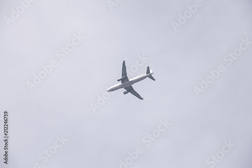 Passenger Airplane flying under the sky