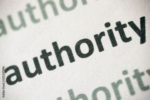 word authority printed on paper macro photo