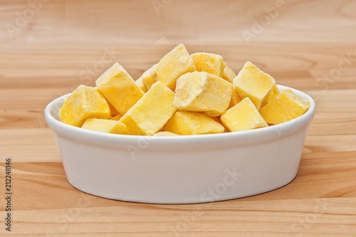 Cut of mango cut to cubes isolated photo