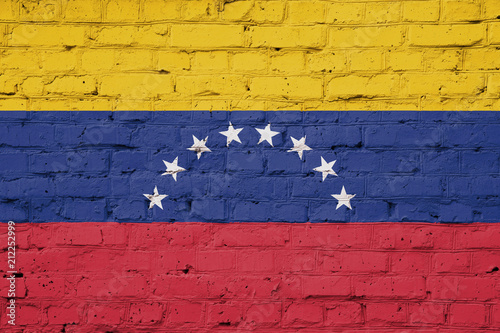 Texture of a flag of Venezuela on a pink brick wall.