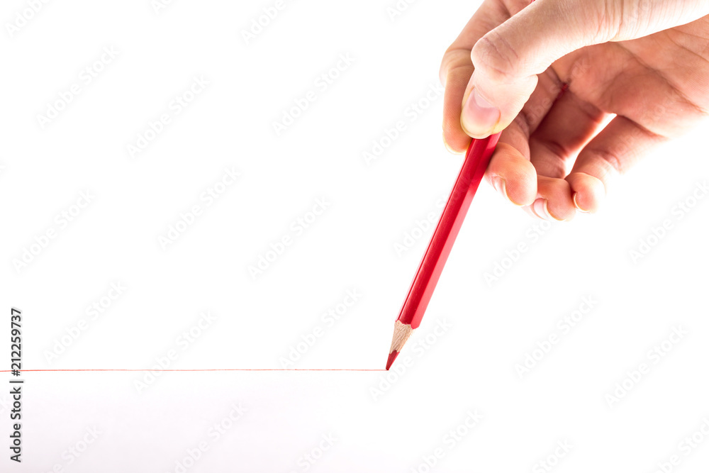 hand with the red pencil on a white background hand with the red pencil on a white background