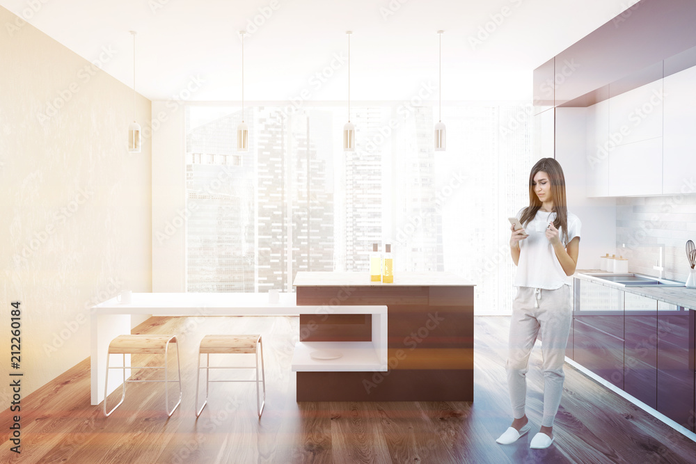 Brown and white loft kitchen interior, woman Brown and white loft kitchen interior, woman