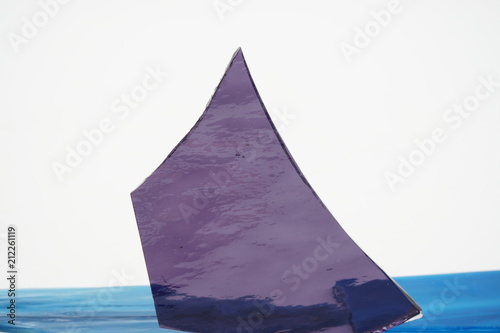 Sharp glass piece on white background