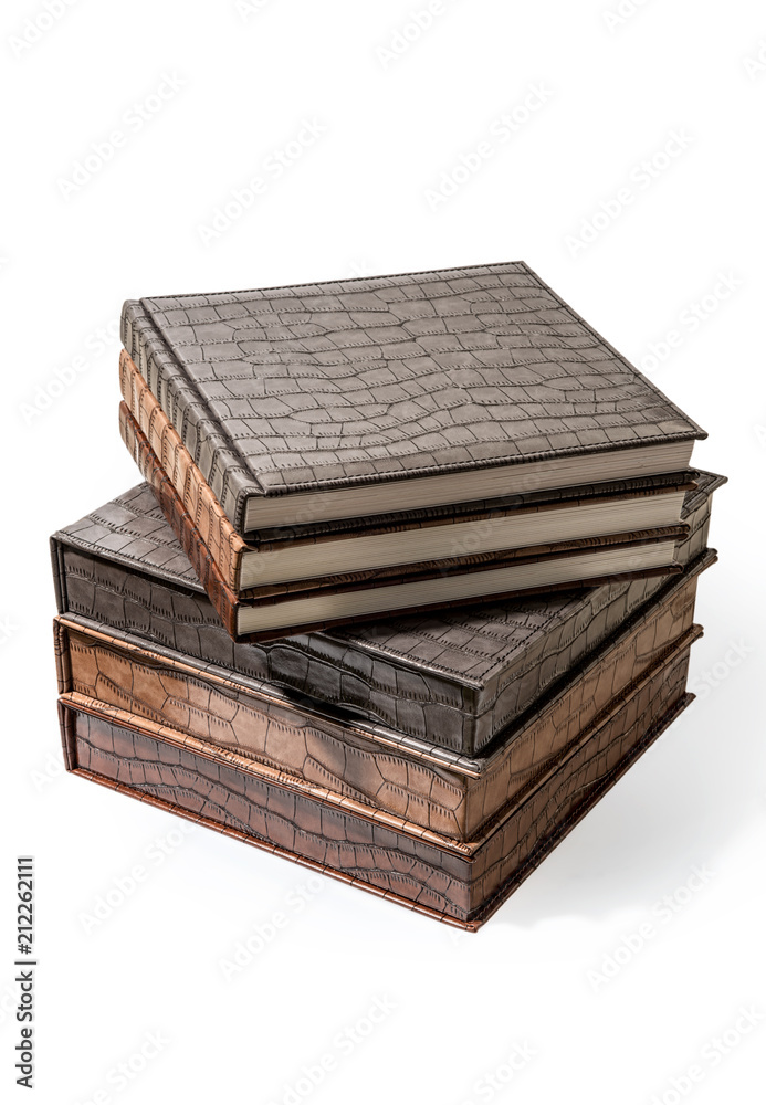 hardcover books lying on a white background hardcover books lying on a white background