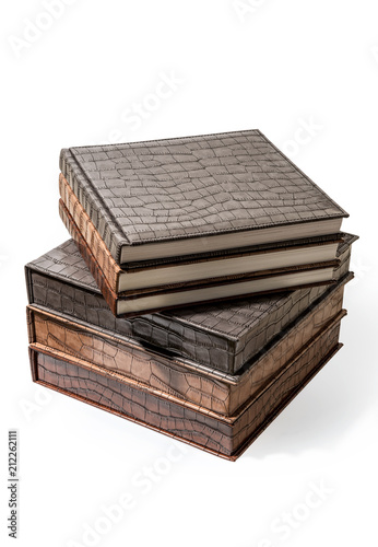 hardcover books lying on a white background