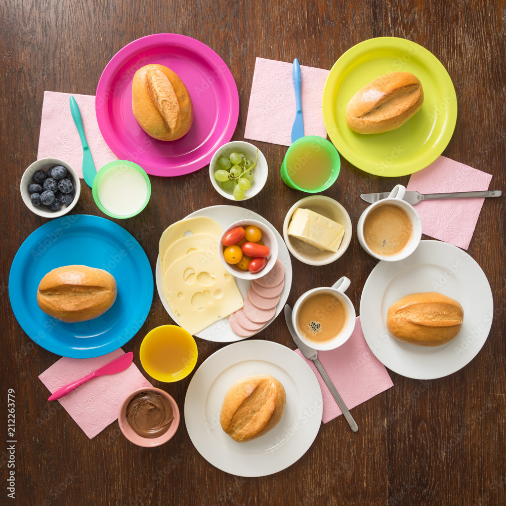 Colourful breakfast table for a whole family of five Colourful breakfast table for a whole family of five