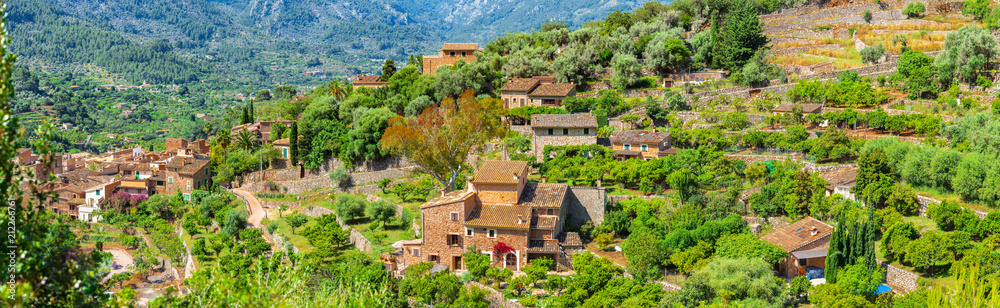 Old village of Fornalutx in beautiful mediterranean mountain landscape, Majorca Spain, panorama view