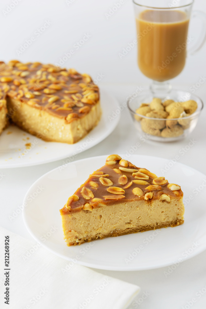 Caramel cake with peanuts and a cup of coffee
