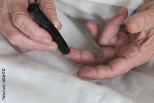old people step by step measuring diabetes. Testing for high blood sugar.