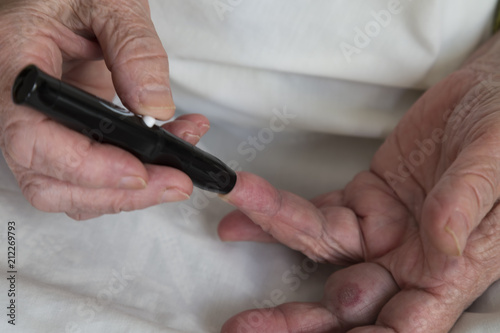 old people step by step measuring diabetes. Testing for high blood sugar.