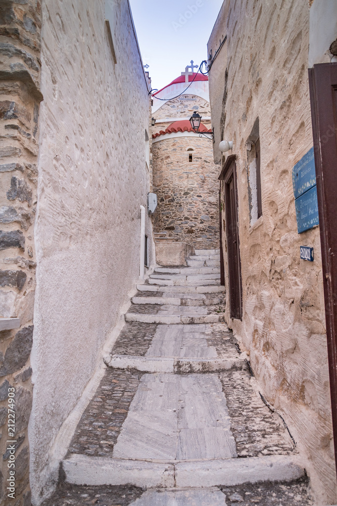 Paved narrow alley of Ano Syros in Syros island, Cyclades, Greece. Street view