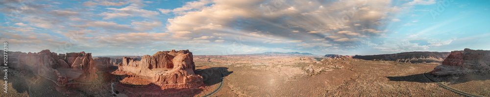 Panoramic sunset aerial view of Arches National Park from helicopter, Utah
