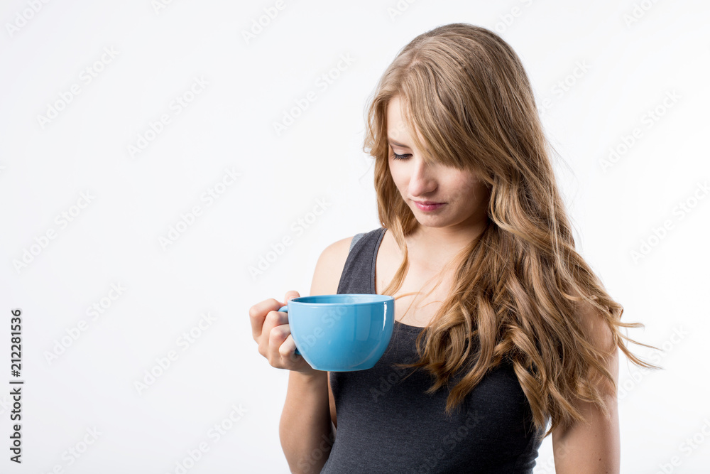 Beautiful young pregnant woman posing with cup of tea . Beautiful young pregnant woman posing with cup of tea .