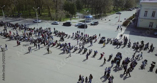 Motoshow in the city square. Many bikers. Aerial view. The audience gathered. photo