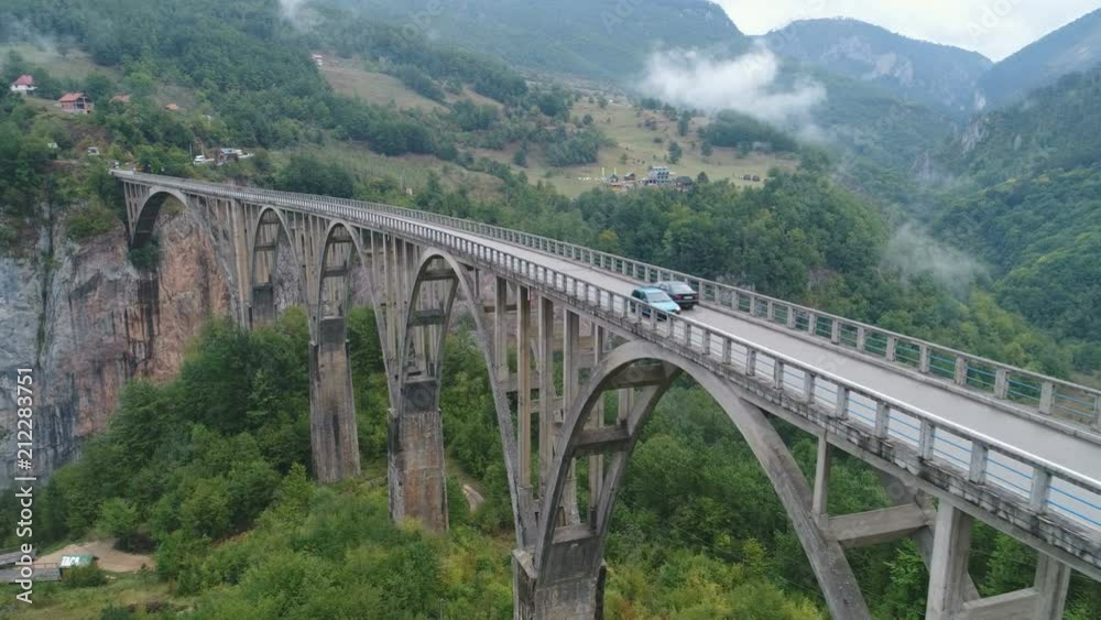 Slow drone flight past impressive Durdevica arch bridge in Montenegro Slow drone flight past impressive Durdevica arch bridge in Montenegro