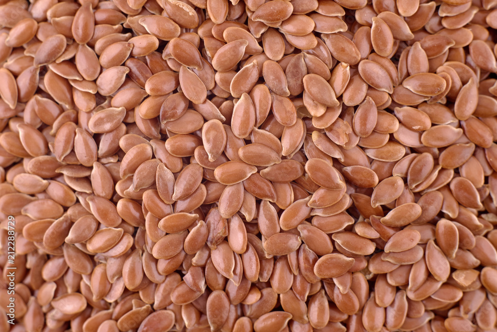 Brown flax seeds background, copy space. Healthy and vegetarian food, dieting concept. Food photography, texture. Top view, flat lay. Flax seed pattern Brown flax seeds background, copy space. Healthy and vegetarian food, dieting concept. Food photography, texture. Top view, flat lay. Flax seed pattern
