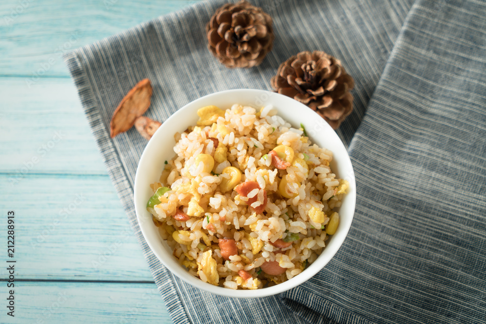 Egg Fried rice with a blue wood grain background Egg Fried rice with a blue wood grain background