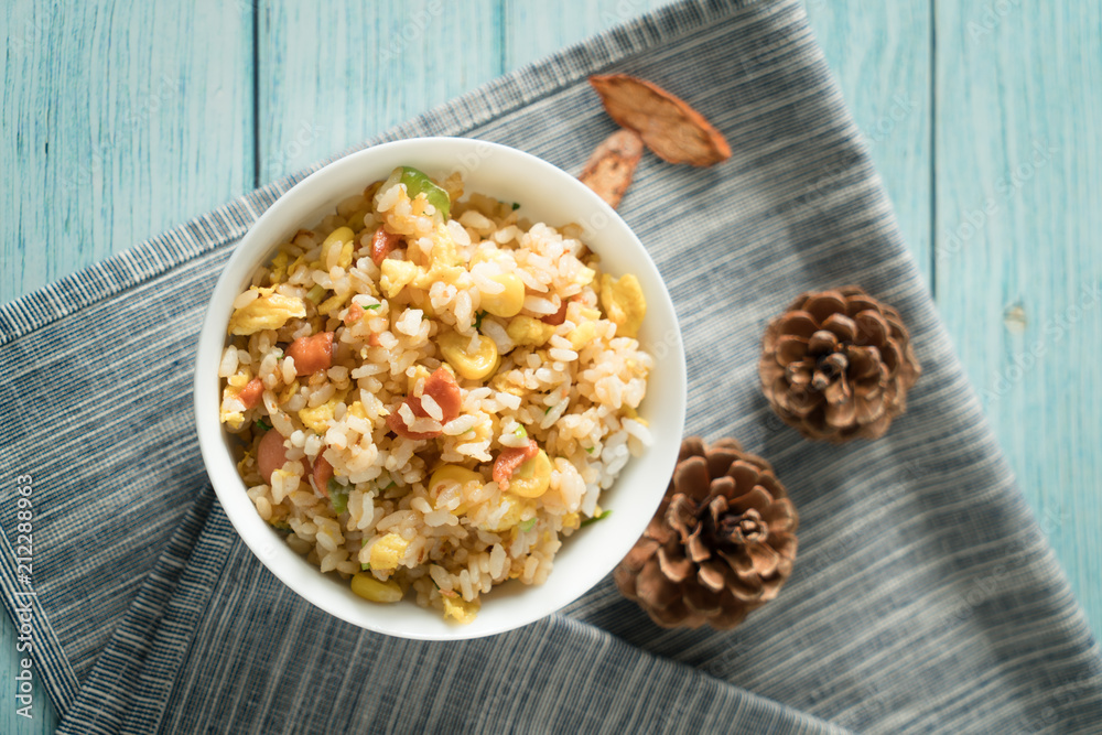 Egg Fried rice with a blue wood grain background Egg Fried rice with a blue wood grain background