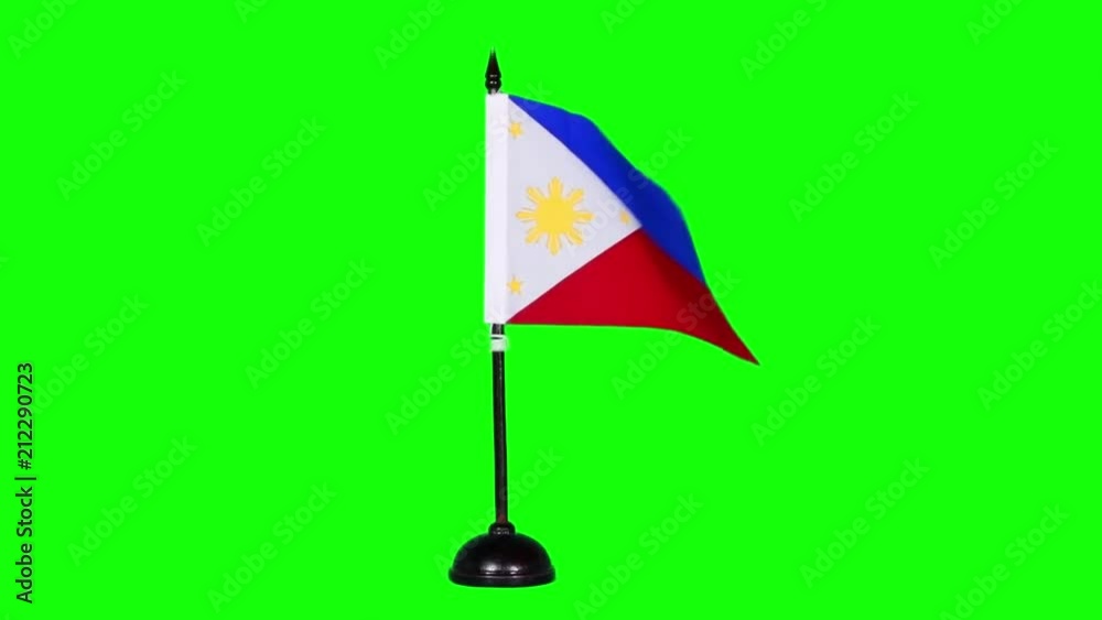 Slow motion of Philippines country flag waving on green screen background in the studio