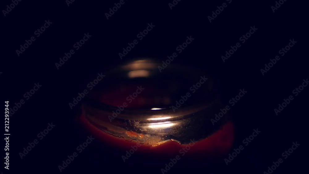 A candle flickers in the darkness. A candle flickers in the darkness.