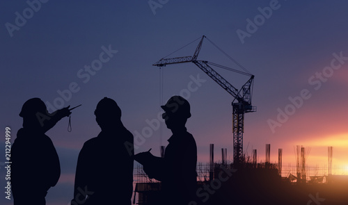 Silhouette engineer standing work on construction.