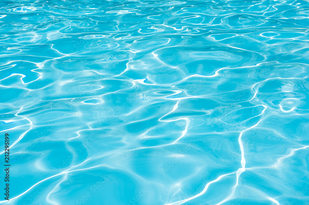 Blue water surface in swimming pool for background and abstract