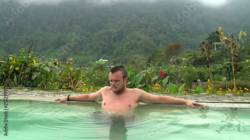 The man farts in the pool with thermal water