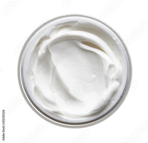 White face cream in a jar on a white