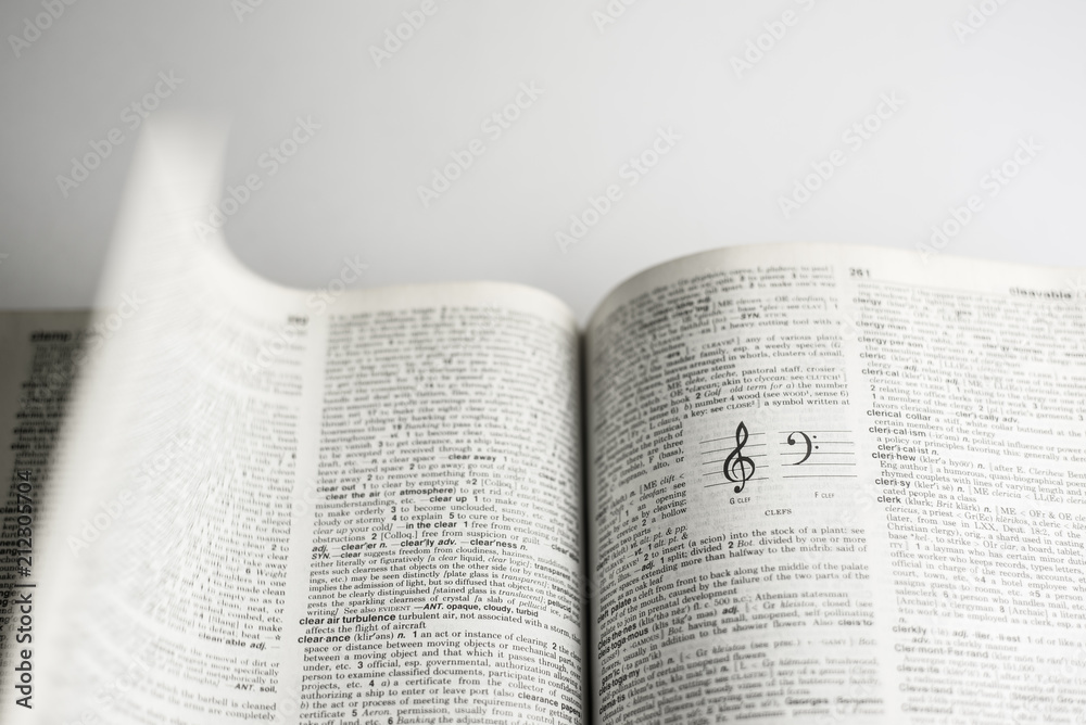 Fototapeta premium G clef printed on text book