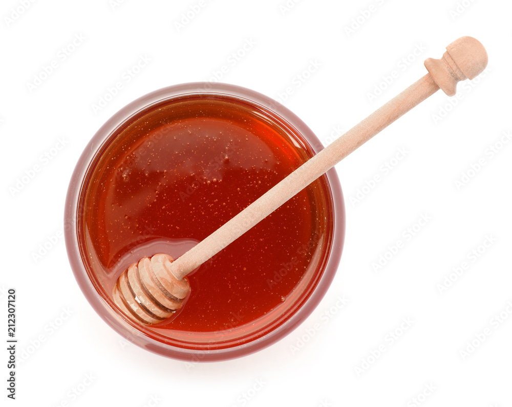 Jar with delicious honey and dipper on white background, top view Jar with delicious honey and dipper on white background, top view