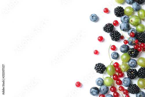 Fototapeta Mix of different fresh berries on white background