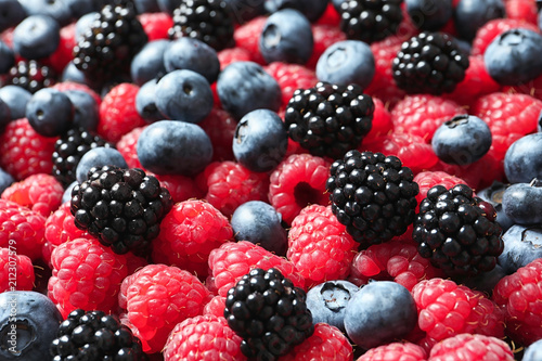 Raspberries, blackberries and blueberries as background