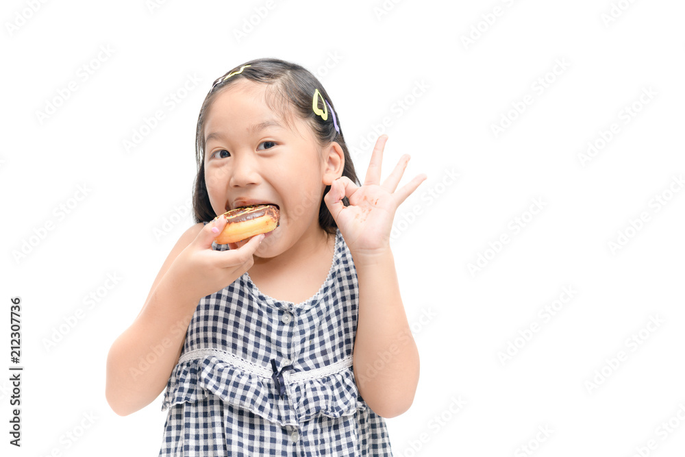 Little happy cute girl is eating donut isolated Little happy cute girl is eating donut isolated