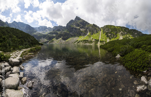 Black lake in summer mountains