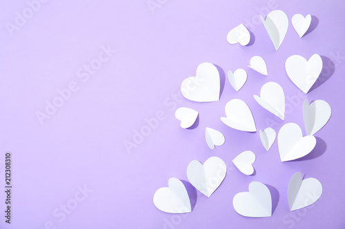 Small paper hearts on color background, top view © New Africa