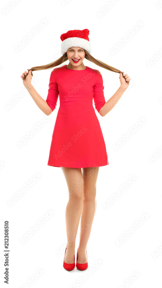 Young beautiful woman in Santa hat on white background. Christmas celebration Young beautiful woman in Santa hat on white background. Christmas celebration