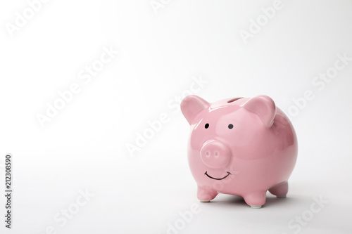 Pink piggy bank on white background. Money saving