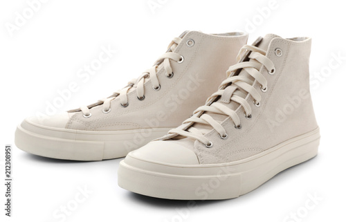 Pair of stylish sneakers on white background