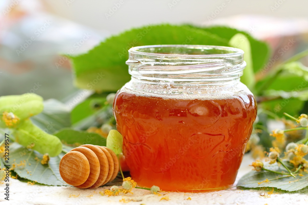 Linden honey in glass jar Linden honey in glass jar