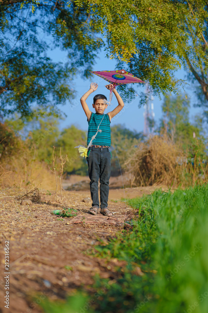 indian child playing with kite