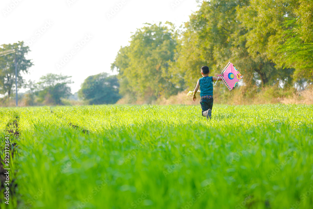 indian child playing with kite indian child playing with kite