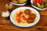 Tasty hummus with falafel