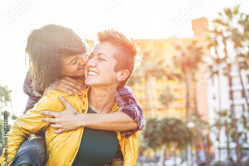 Happy gay couple having fun together outdoor