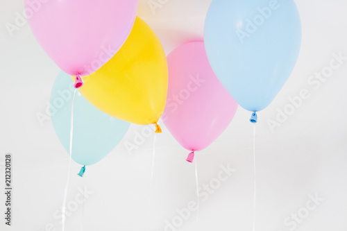 Colorful party balloons background. Isolated on white. Copy space photo