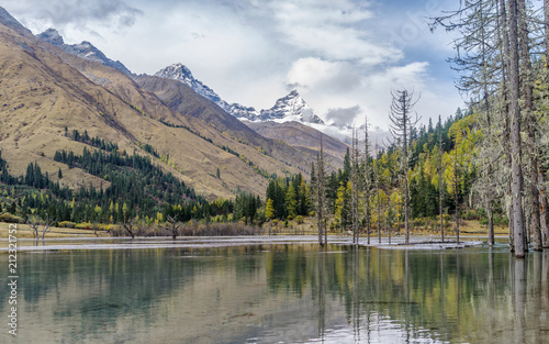 Landscapes of snow mountains  forest  and peaceful lake  in  Four Girls Mountain   sichuan  China.