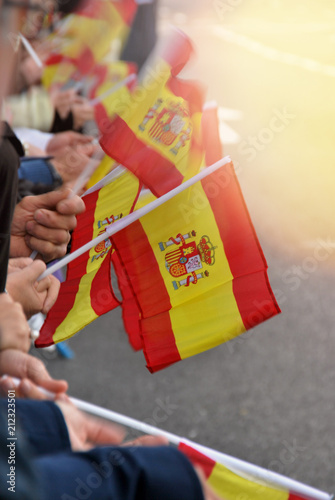 spain flags held by people