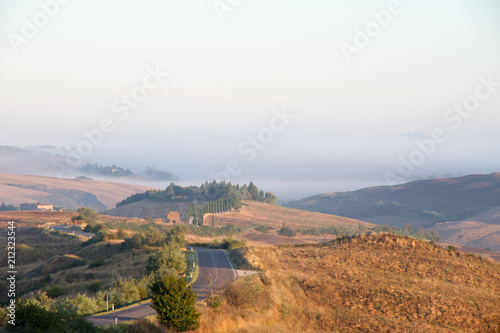 Crete Senesi landscape in Tuscany  Italy on a foggy dawn