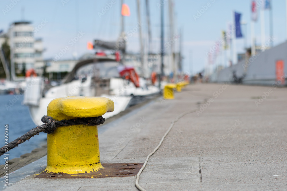 Harbor bollard for large naval vessels. The port wharf in central europe. Harbor bollard for large naval vessels. The port wharf in central europe.
