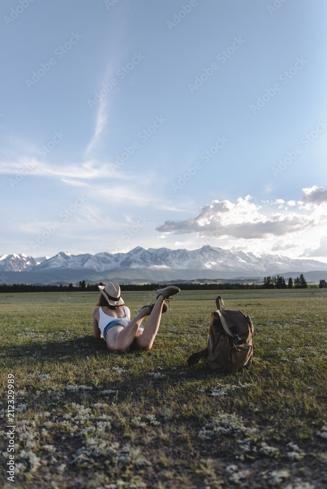 girl laying on the grass girl laying on the grass