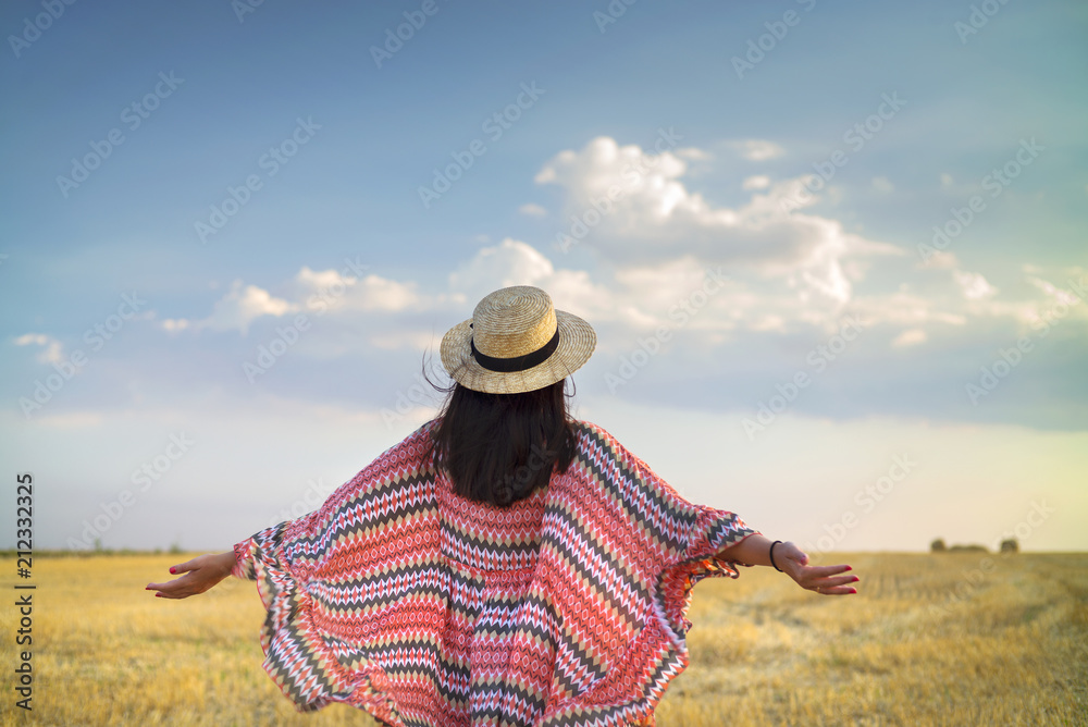 girl in hat with two hands up in country landscape girl in hat with two hands up in country landscape